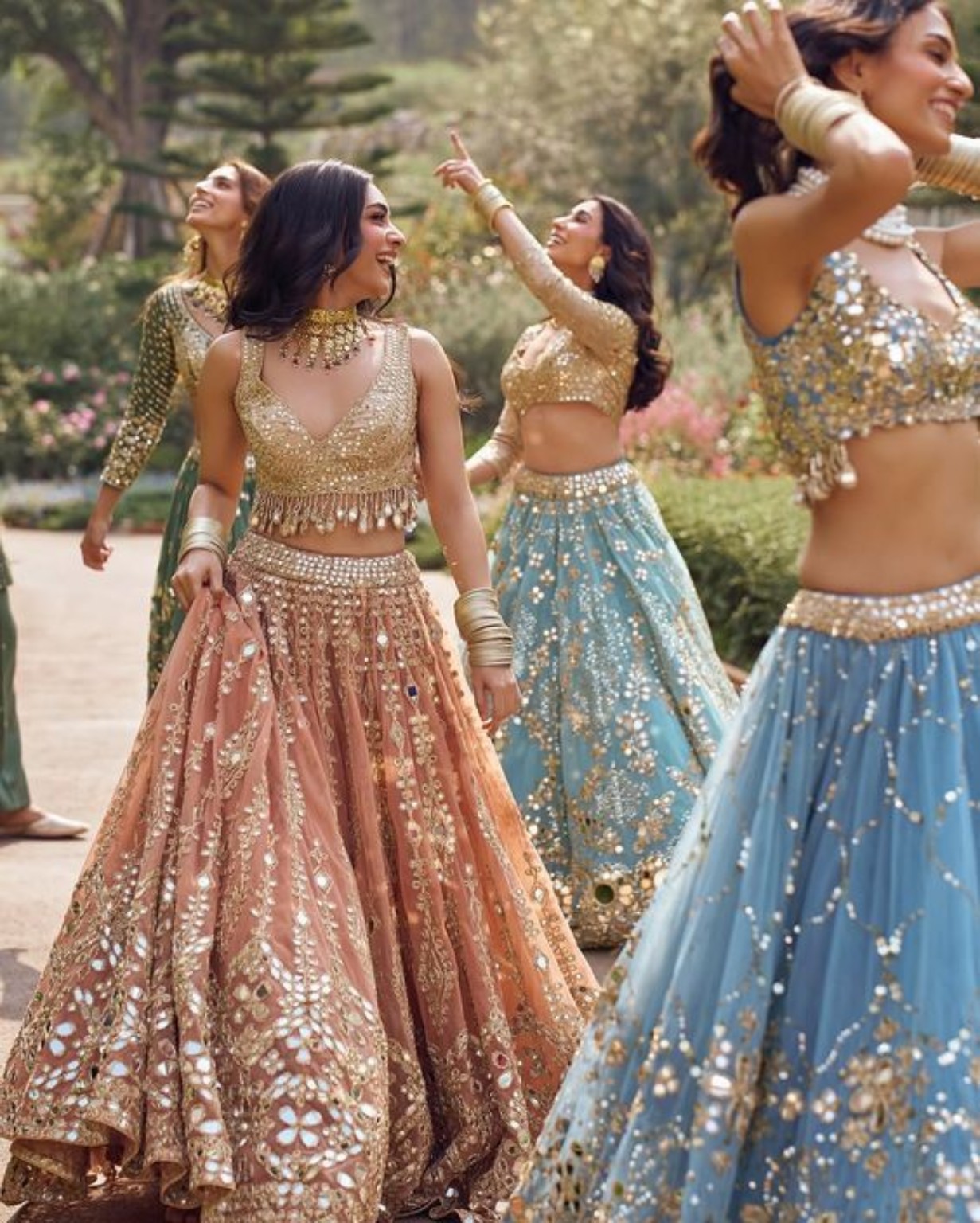 Indian festive couture in a garden setting